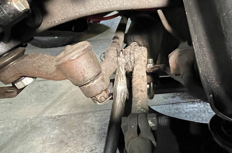 To complete the rebuild, we replaced the inner and outer tie rods with new Duralast pieces. Off came the cotter pins and nuts followed by a few blows with the ball joint separator. 