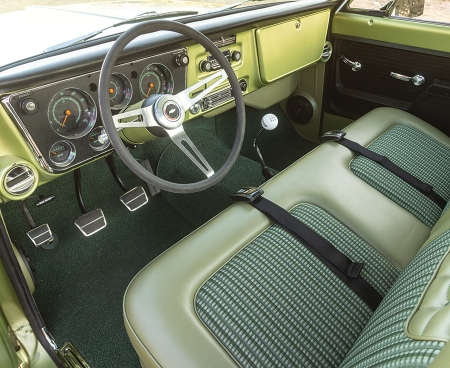 '71 C10 truck interior view of wheel, seats, and dashboard