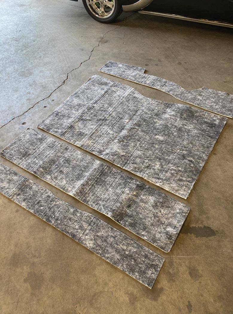 Design Engineering’s “topcoat” Under Carpet Lite sound absorption insulation pieces laid out on the garage floor