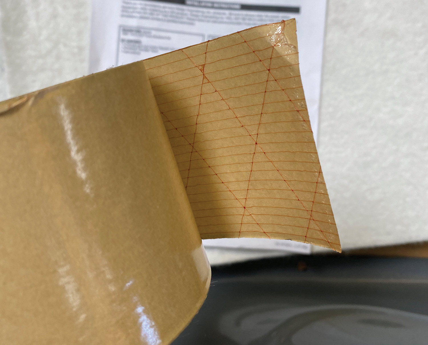 close view of the roll of adhesive transfer tape