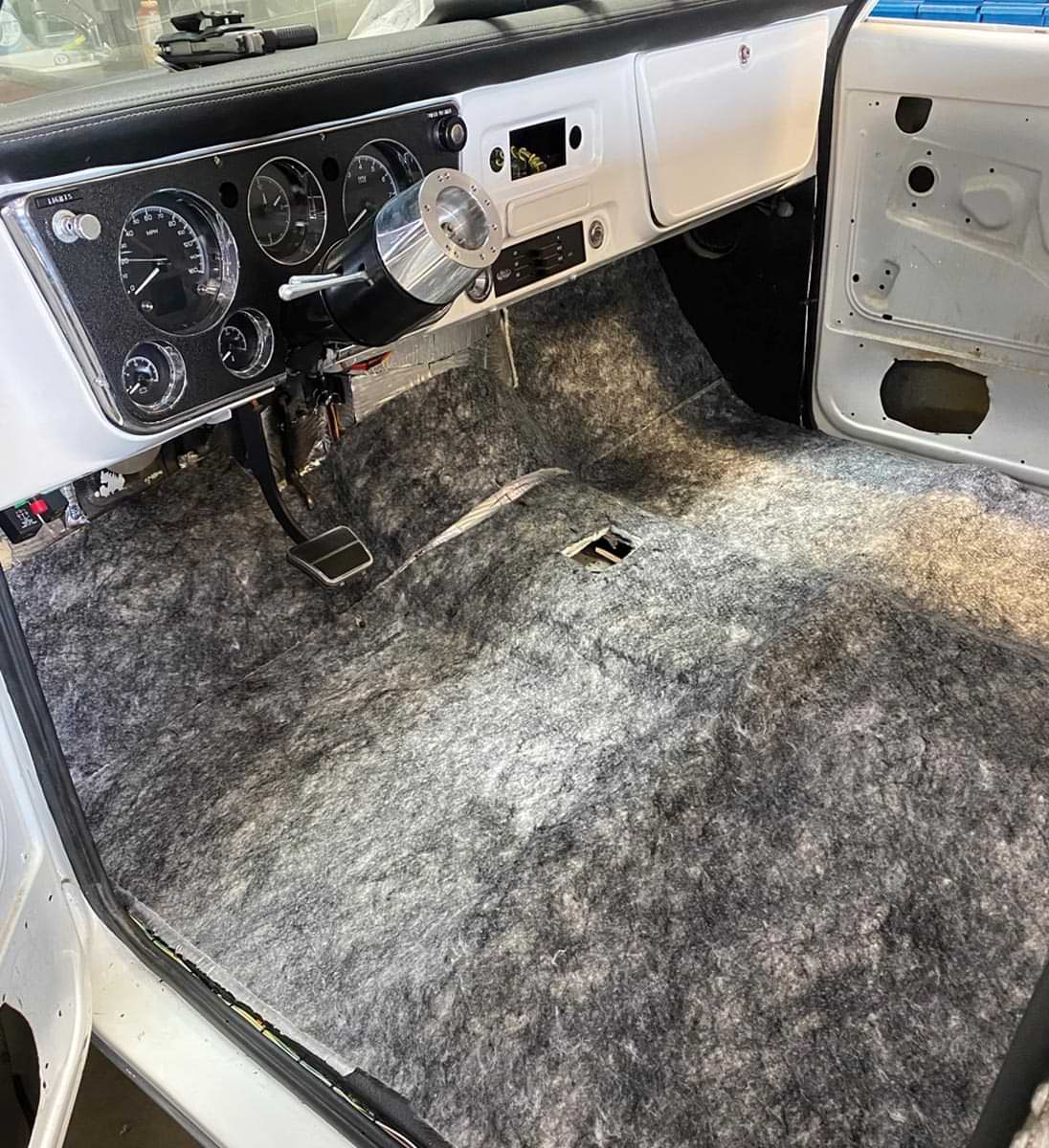 view inside the cab from the drivers side, showing the floor lined with Under Carpet Lite material