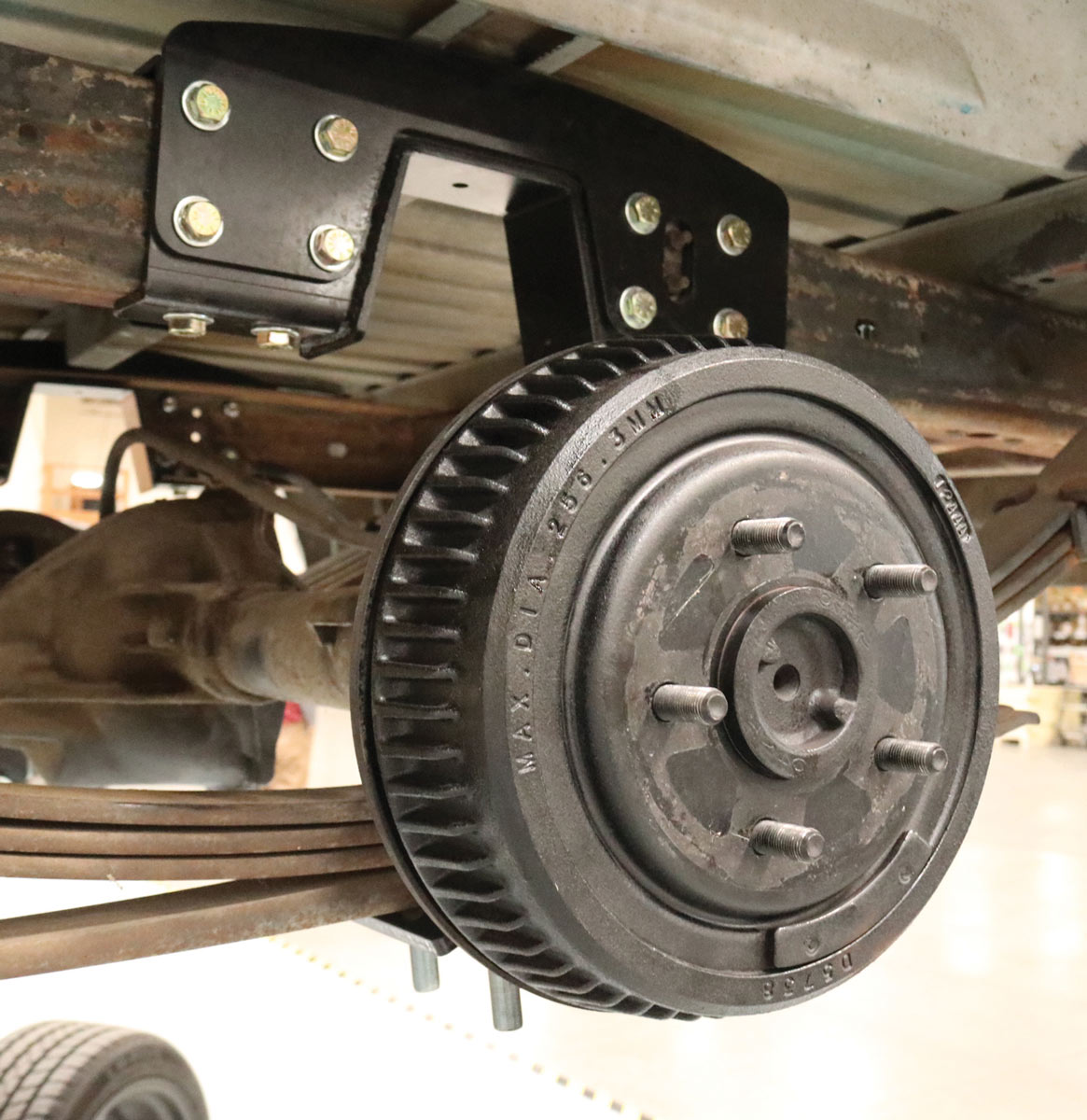 close up of the soon to be replaced, oh-so-familiar 10-inch drum brake