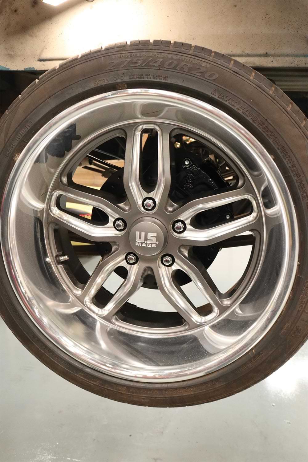 the newly installed brakes covered with a 20-inch contrast-cut U.S. Mags rimmed tire