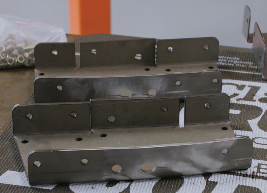 The 1/4-inch C-channel plates are designed to temporarily attach and support the chassis until final welding can be completed. These plates have matching holes that mirror the templates and now the chassis. 