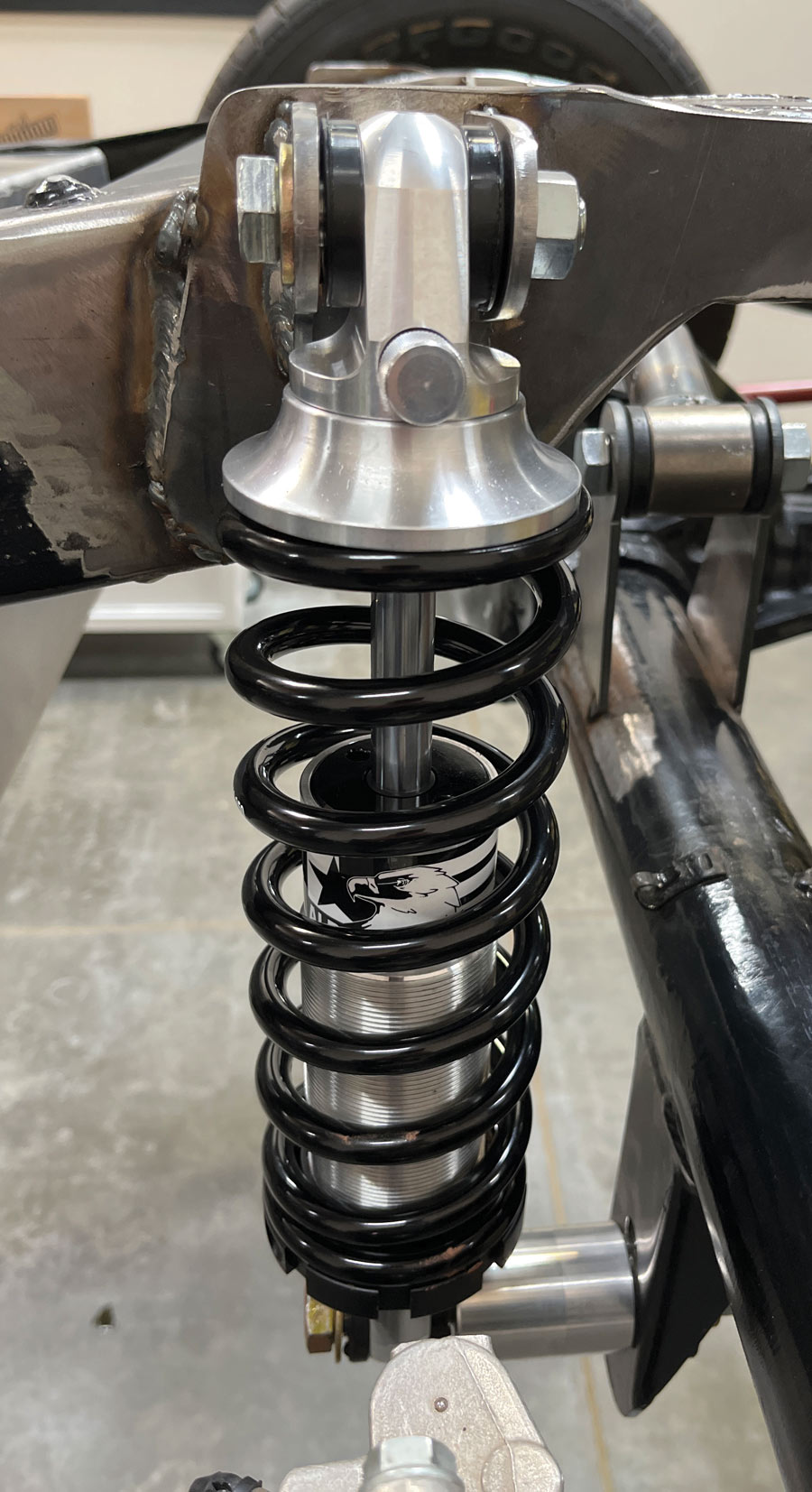 Coilover mounting bolts should always be front to rear to allow articulation during suspension movement