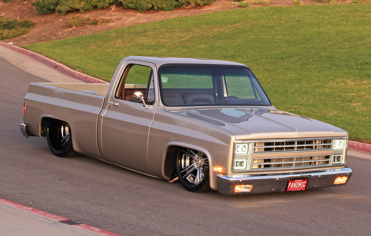 ’86 C10 truck grey truck going down the road