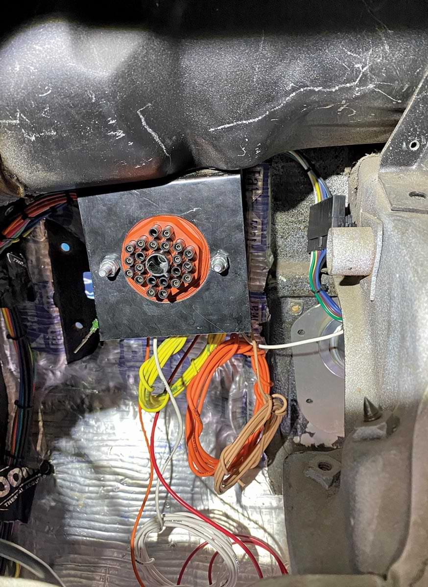 a wiring part mounted beneath the dash