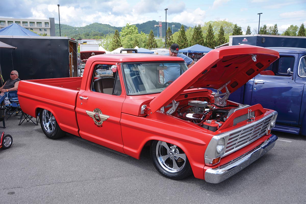 lowered red 60s ford f100 shop truck