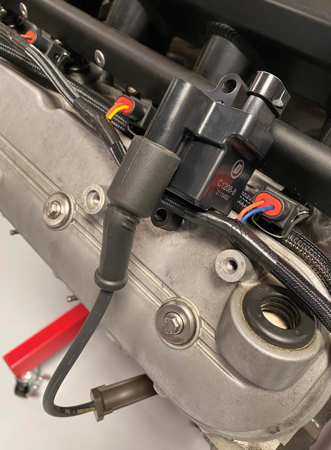 a set of Duralast ignition coils (PN C1208-8) and plug wires (PN 4713) installed to the block