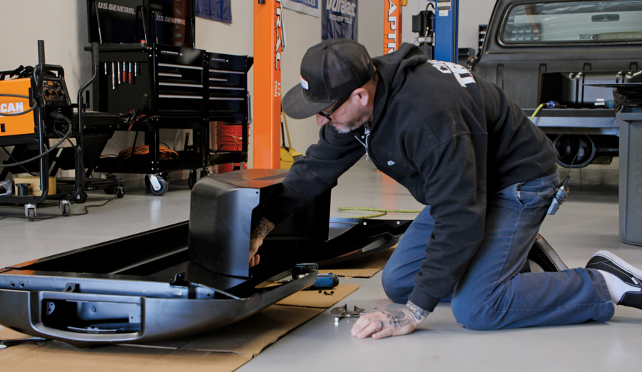 ITGM Tech Center manager Jason Scudellari takes a couple measurements before attaching the wheelhouse panels via sheetmetal screws