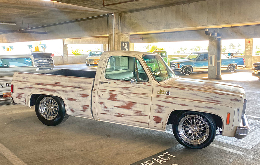 white truck with brown spots