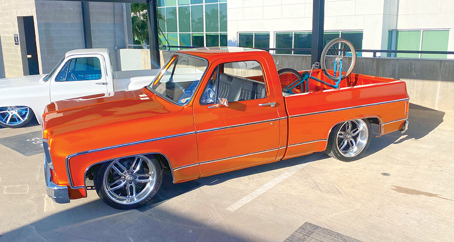 orange truck with bike in trunk