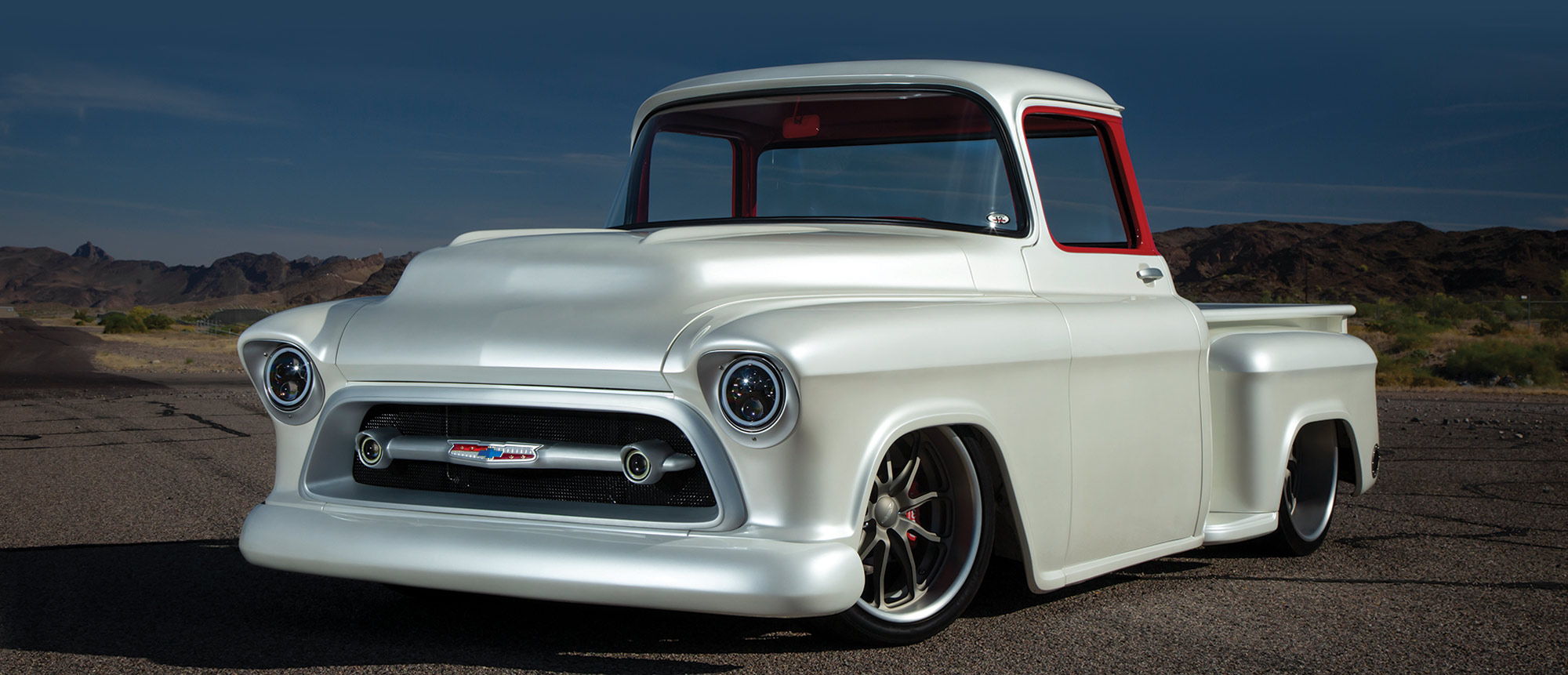 white '57 Chevy with red window frames