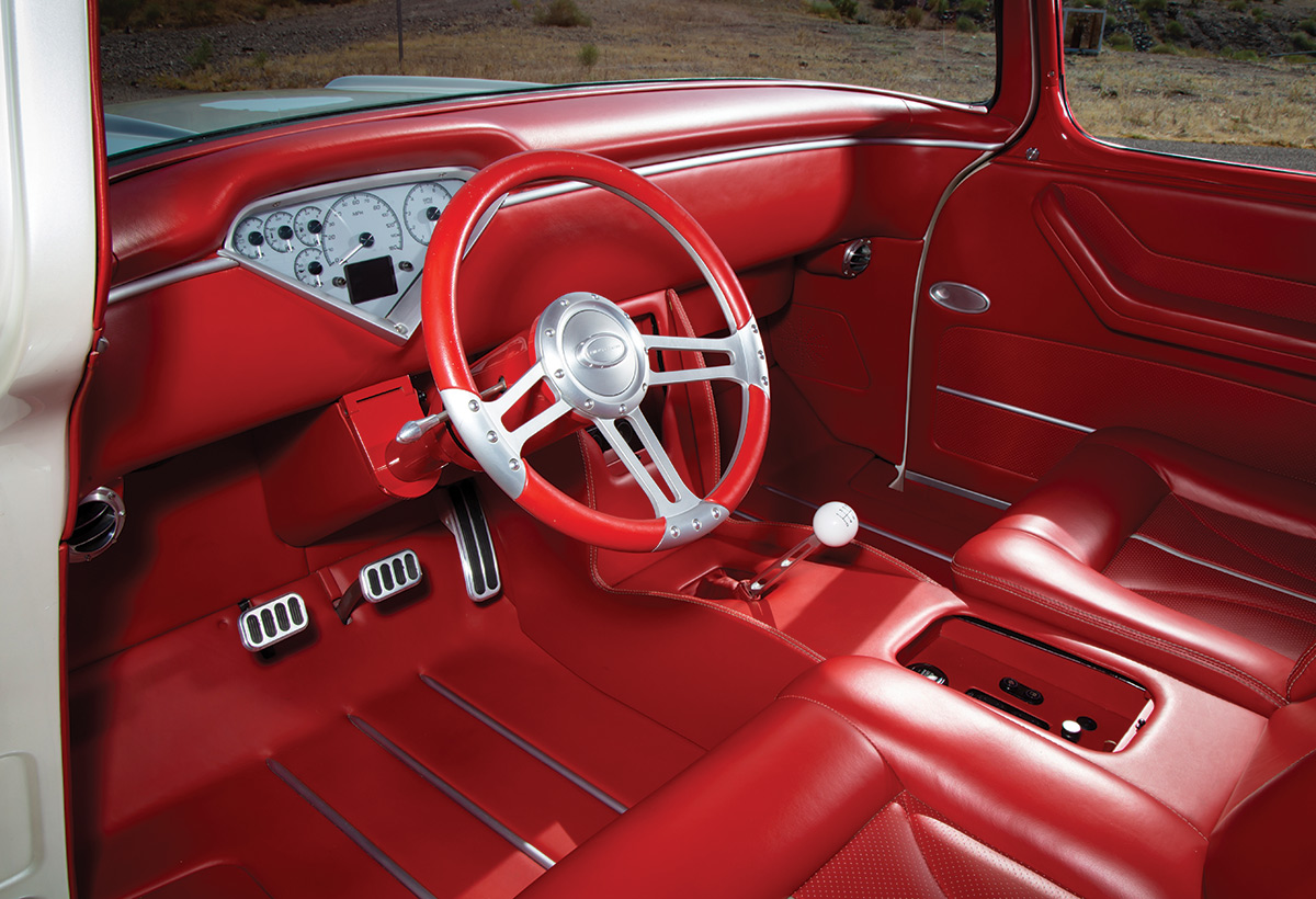 white '57 Chevy steering wheel and dashboard interior view