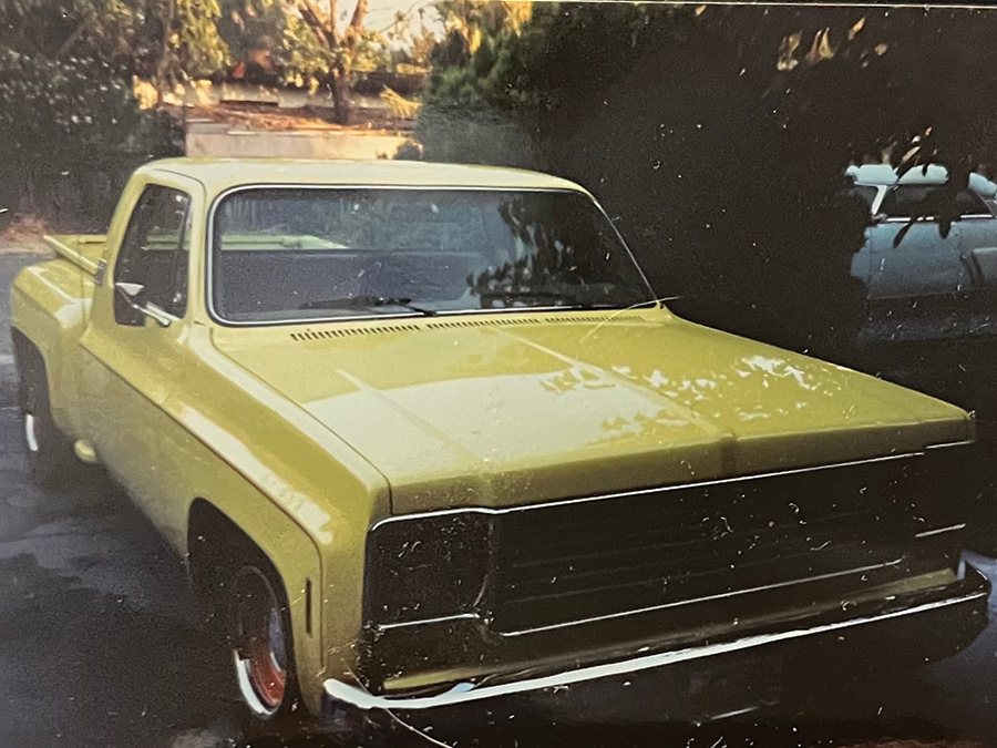 A front view photograph perspective of a 1974 Chevrolet Stepside Pickup Truck parked in a driveway
