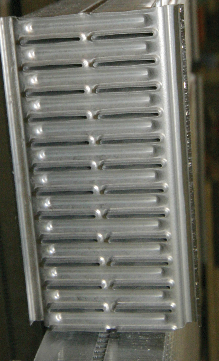 By comparison this is the header of an aluminum Afco radiator; it uses two rows of 1-inch tubes.