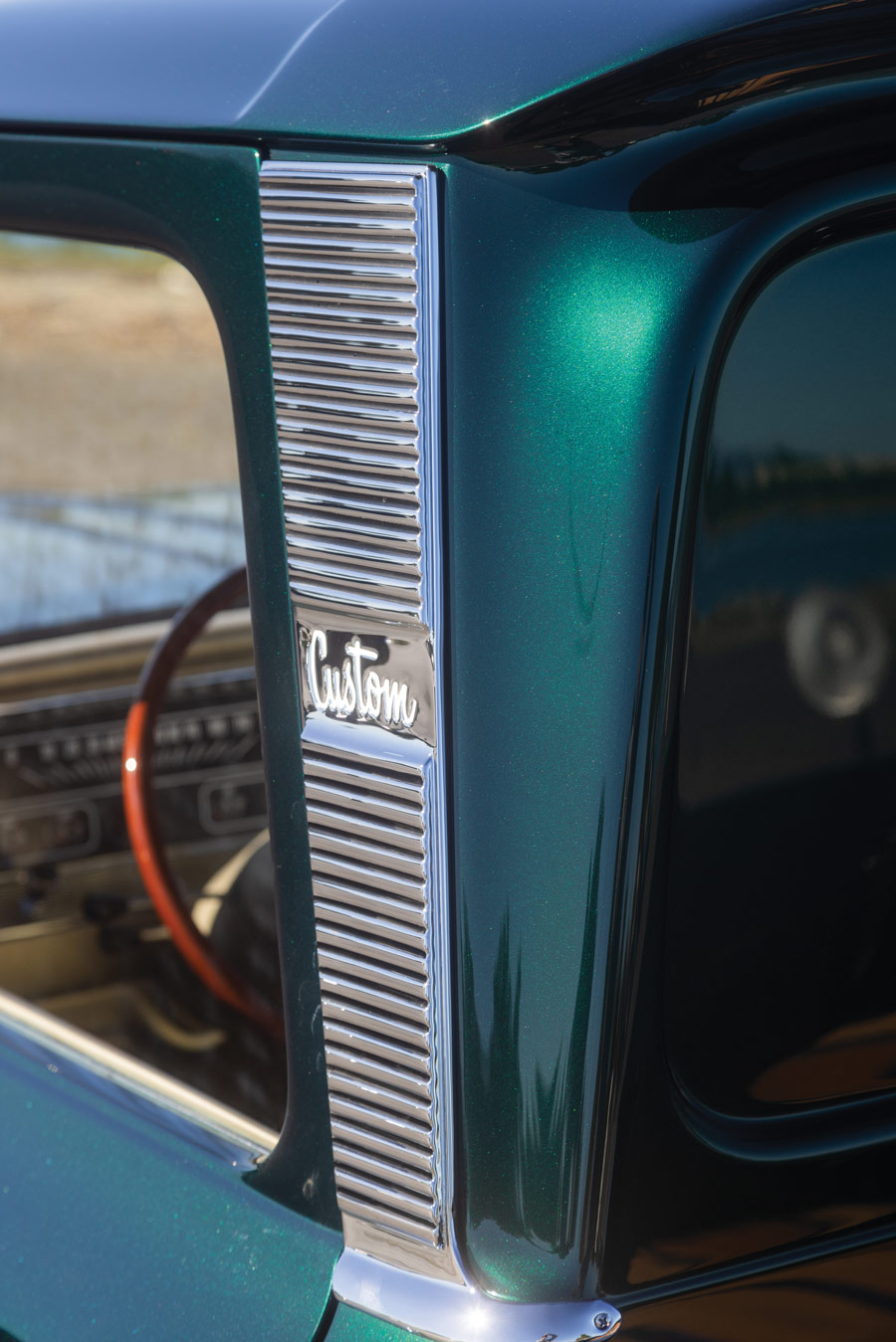 close up of a green '65 Chevy C10 panel
