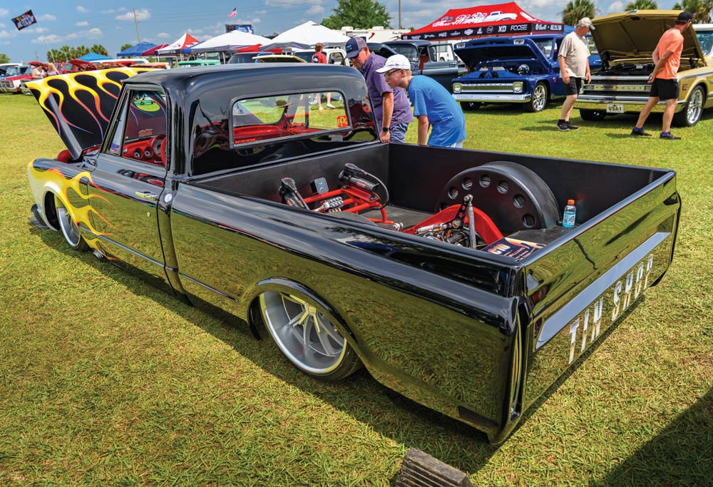 Lowered black with flames C10 "TIN SHOP" on tailgate
