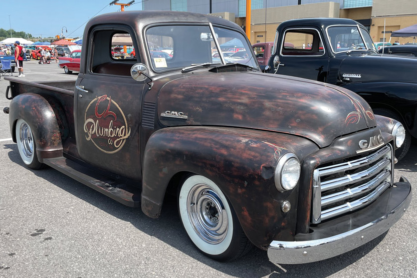 brown classic pickup truck with "CL Plumbing" written on the side