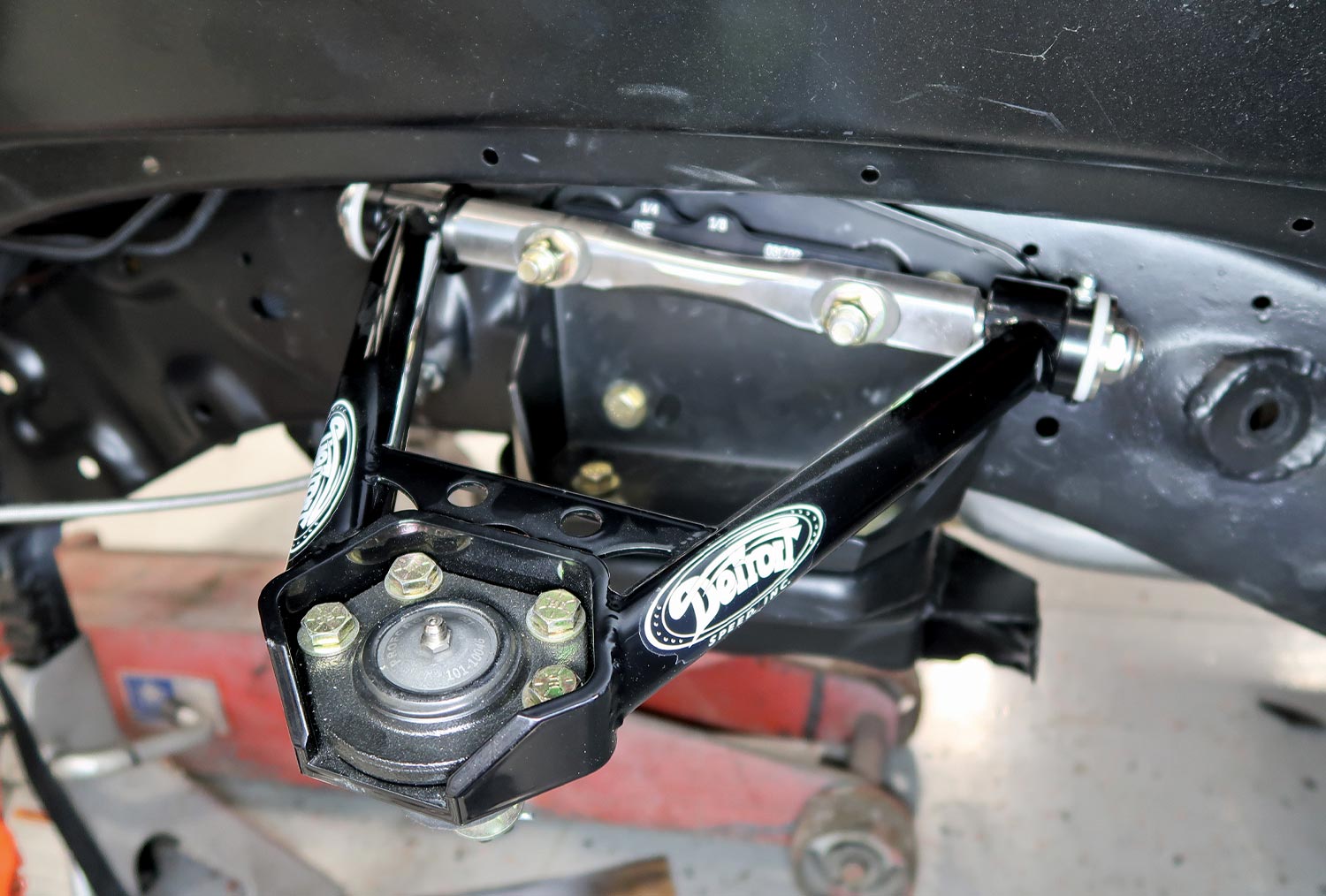 with the mounting brackets bolted in place the upper control arms are installed