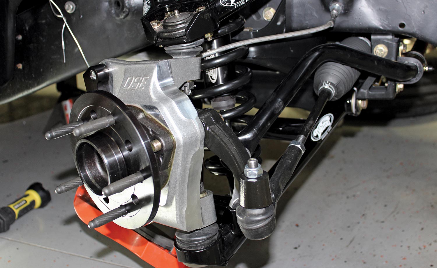 forged steel steering arms are attached to the DSE forged aluminum spindle assemblies