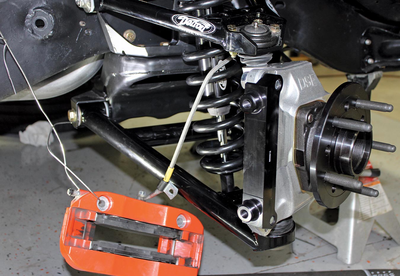 view of the caliper mounting bracket that mounts to the back of the hub