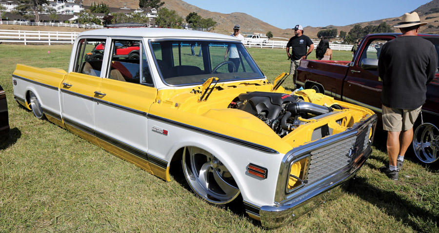 yellow and white truck with no hood