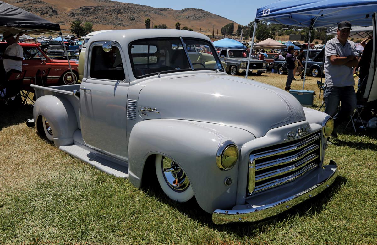 gray truck parked on grass