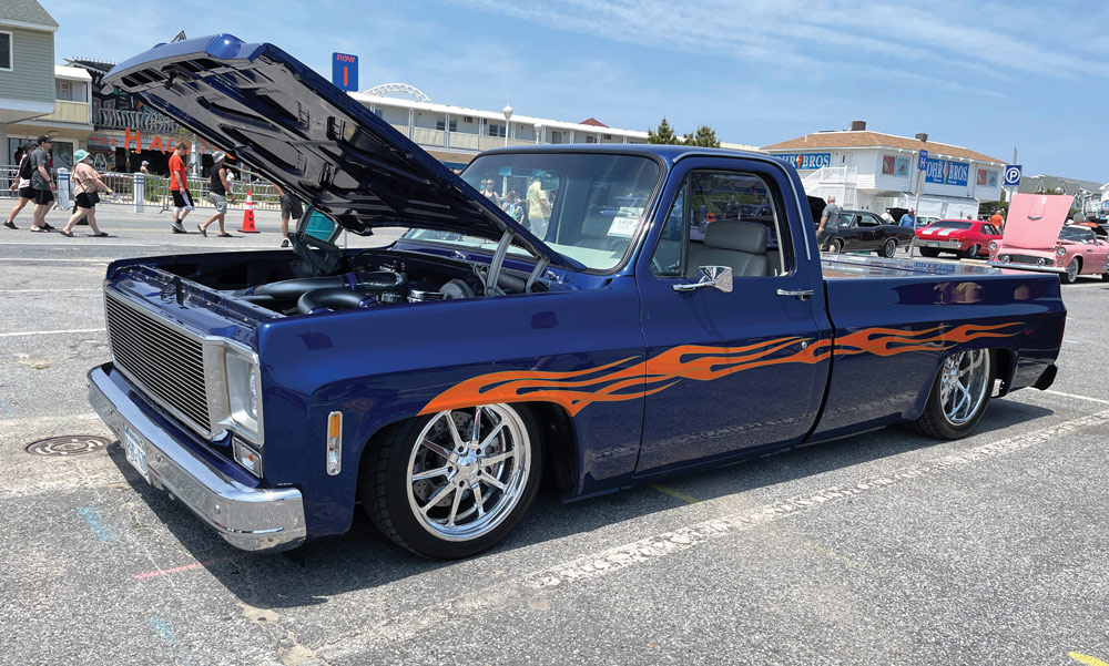 Lowered dark blue longbed Squarebody with flame down the side