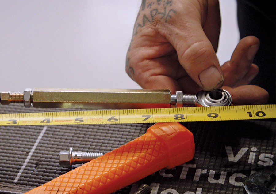 Measuring the pushrod with yellow tape