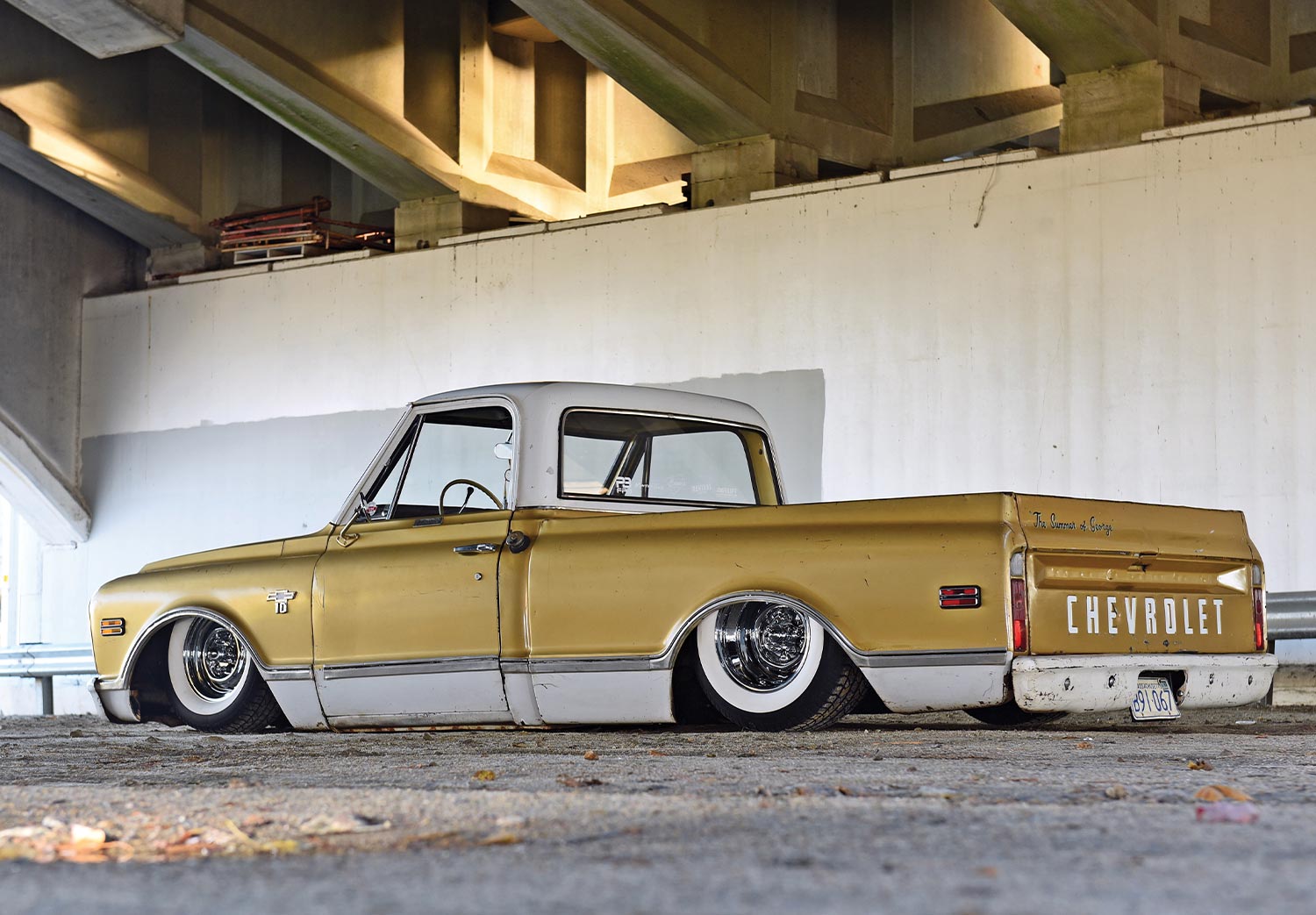 three quarter back view of the '68 C10 parked beneath an overpass