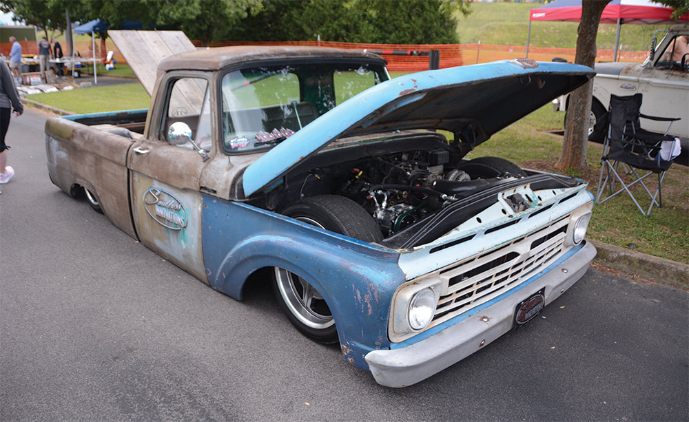 Slammed with wheel well delete blue and patina 4th gen F100