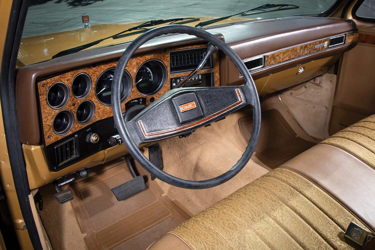 the '84 GMC Sierra's steering wheel and dashboard