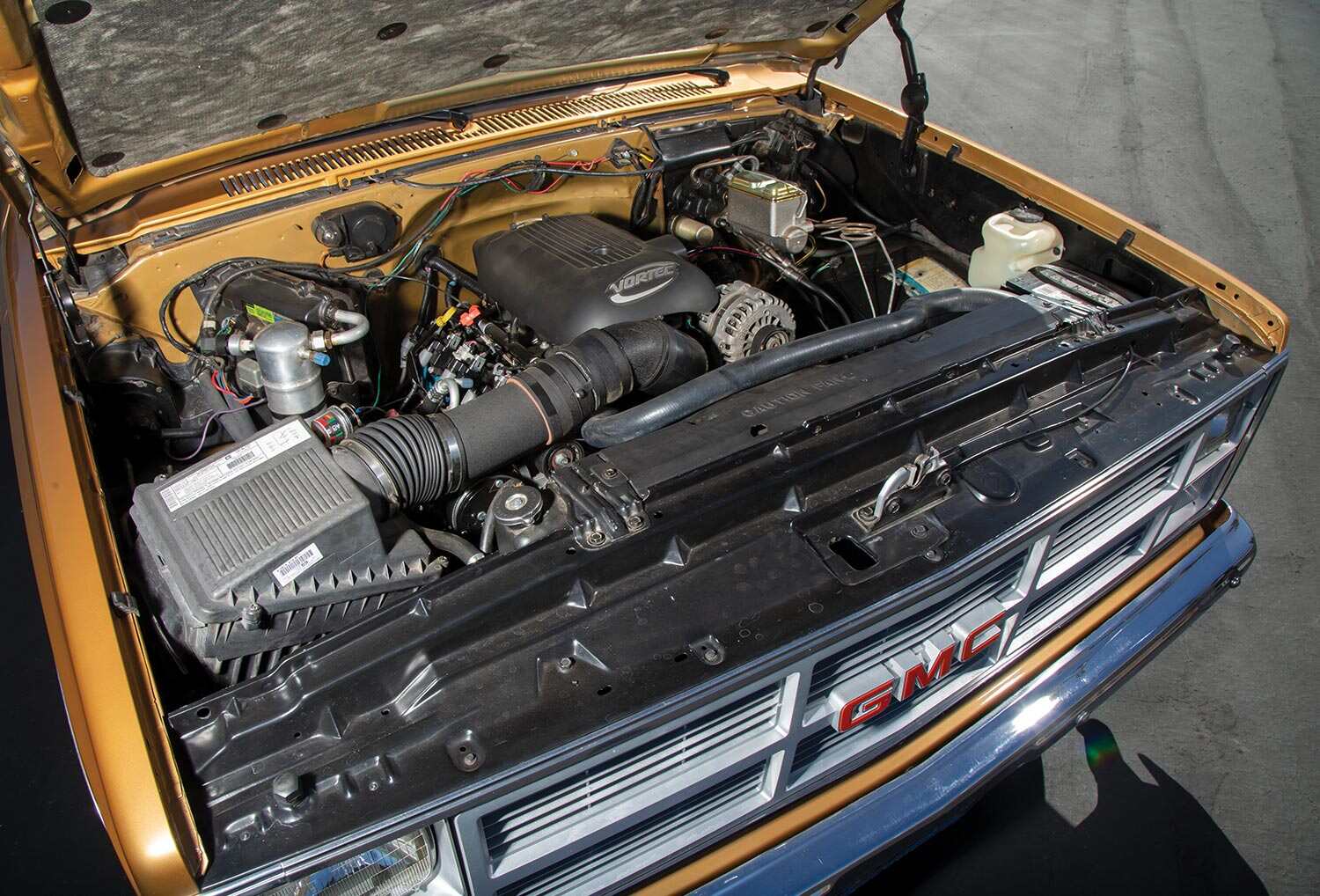 full view under the hood of the '84 GMC Sierra