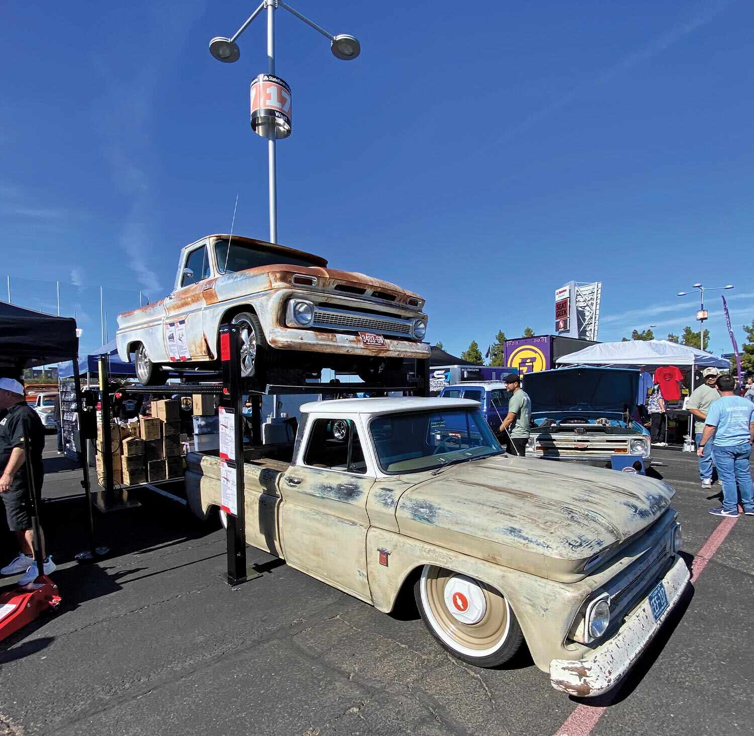 two patina worn classic trucks on display
