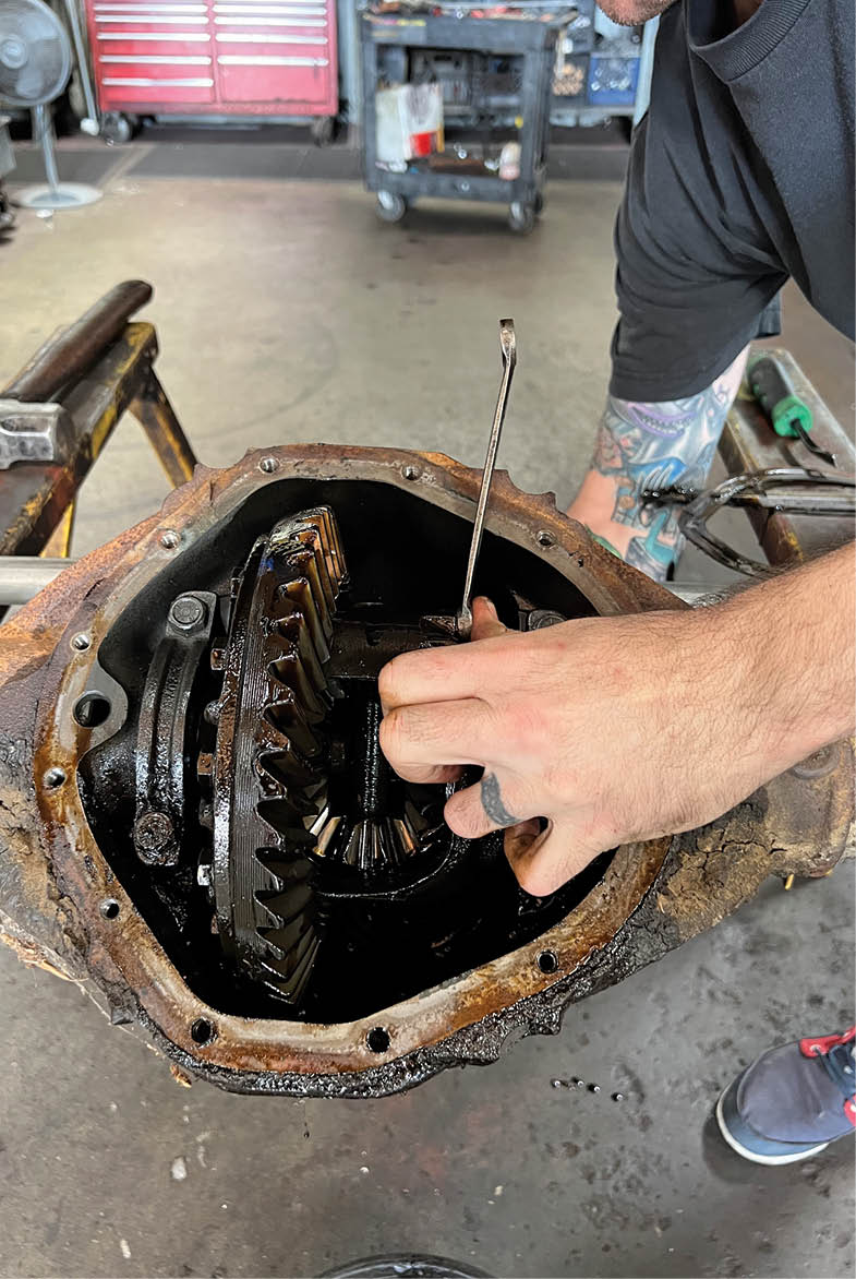  Once the retainer bolt is removed the pinion shaft will slide out of the differential case.