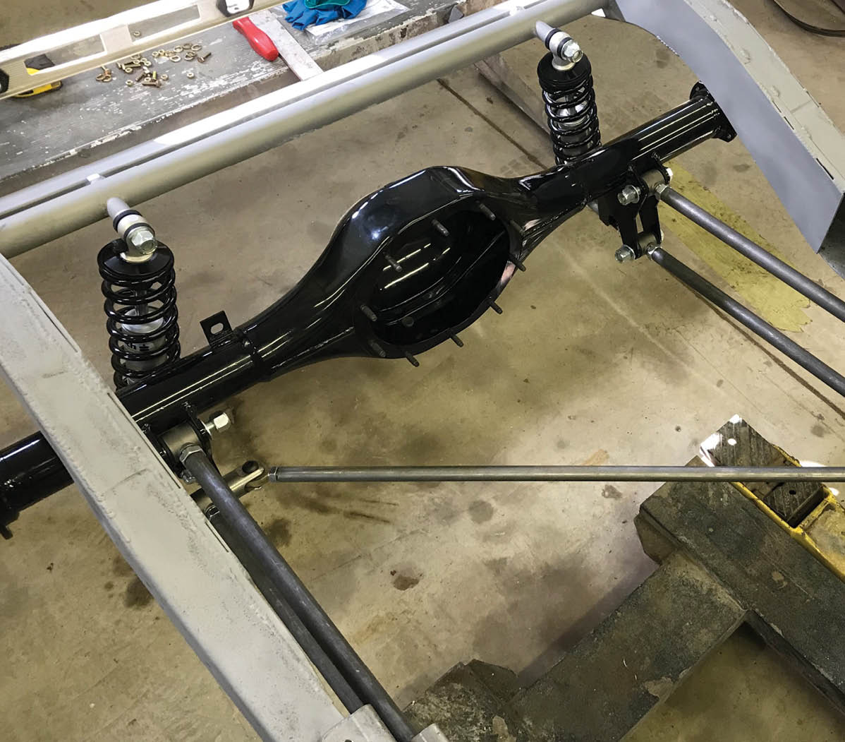 The rear suspension is made up of coilovers, four-bars, and a diagonal locator all from Total Cost Involved (TCI). John’s Industries supplied the 9-inch Ford axle housing.