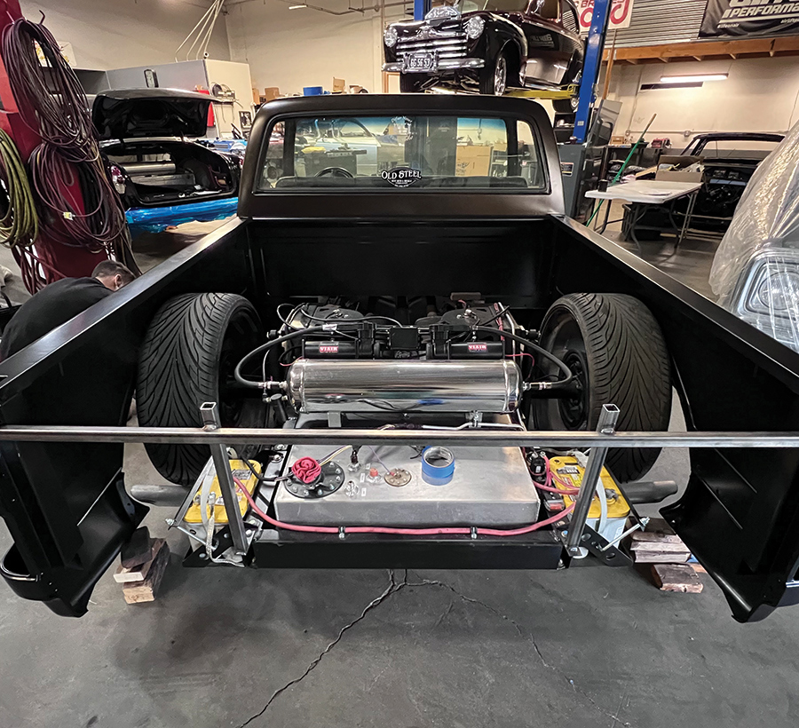 Since the floor will be “highly” elevated, the bed floor’s integrated rear crossmember will not locate and mount the rear of the bed as it normally would; for now, a temporary square-tube brace was used.