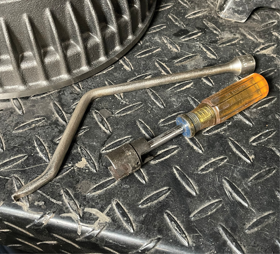 These two tools will make life a lot easier when replacing the shoes. The nutdriver has a special socket designed to remove the shoe hold-down retainers while the other tool will easily remove and help install the different springs.