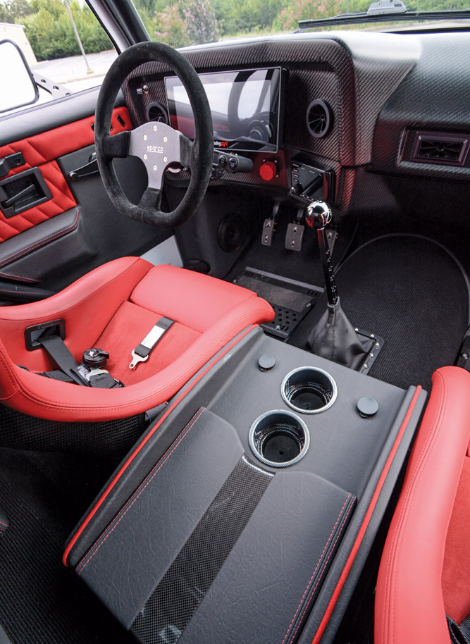 red and black interior with electronic radio and cluster