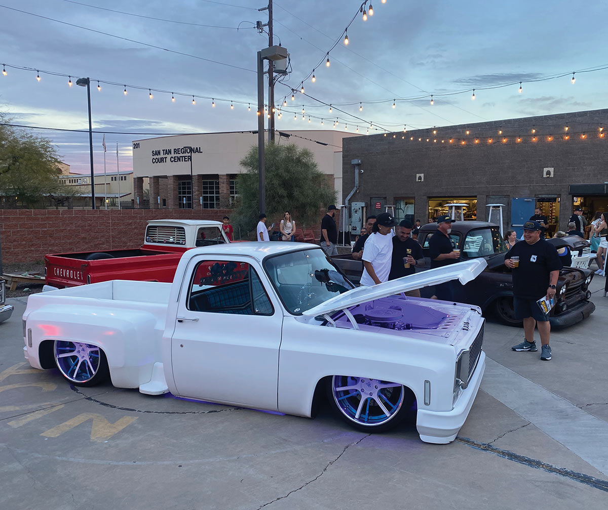 Bagged white Squarebody stepside with UV purple accent lighting