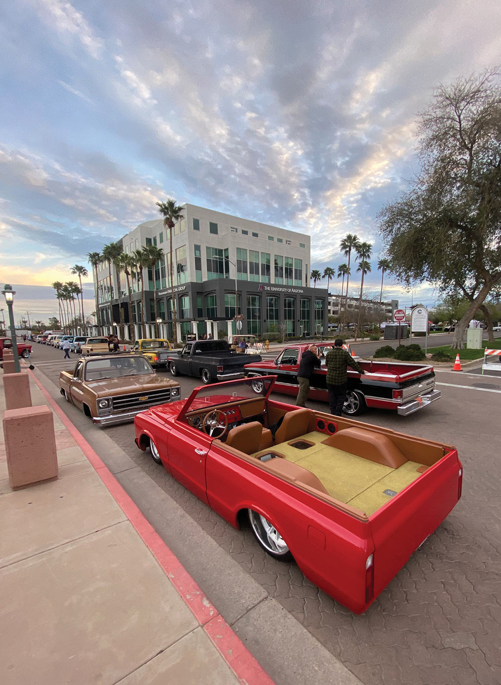 Slammed brown Squarebody and slammed red over saddle K5 open-top