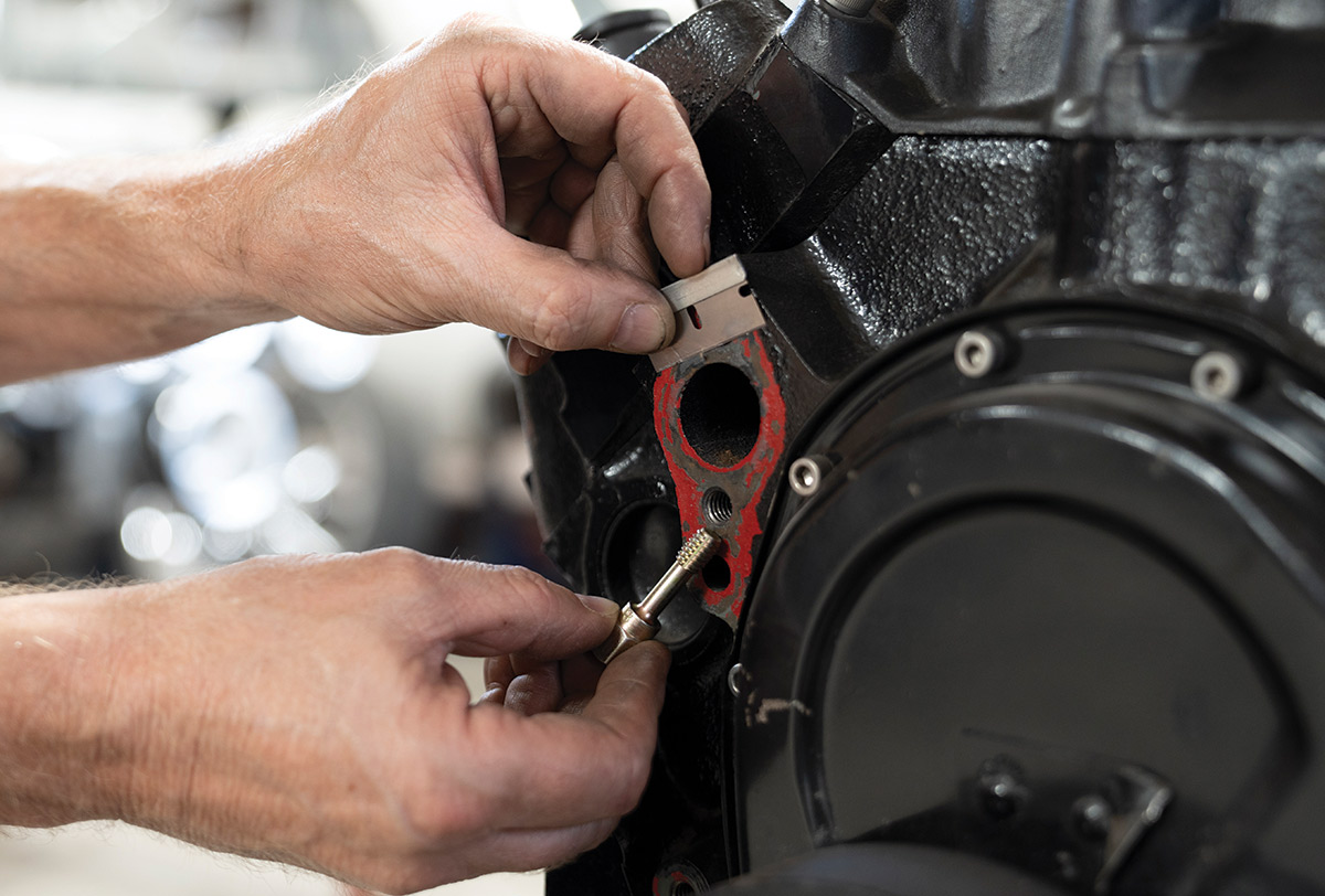 There’s a huge variety of stock V-belt configurations on small-block Chevy engines, so we’ll skip the teardown portion and move directly to the pre-serpentine prep. First and foremost, carefully—and thoroughly—remove ALL gasket AND sealant material from the water inlets/outlets. Then, just as carefully, chase all forward-facing mounting holes (with a thread chaser not a thread tap!) to clean out any old Loctite and/or sealant. (Also, verify the timing cover is sealed and not leaking, as now’s the time to address that!)