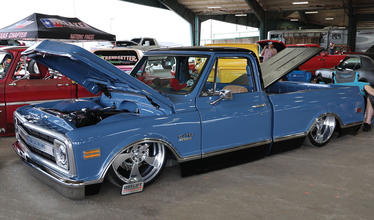 blue truck with hood open