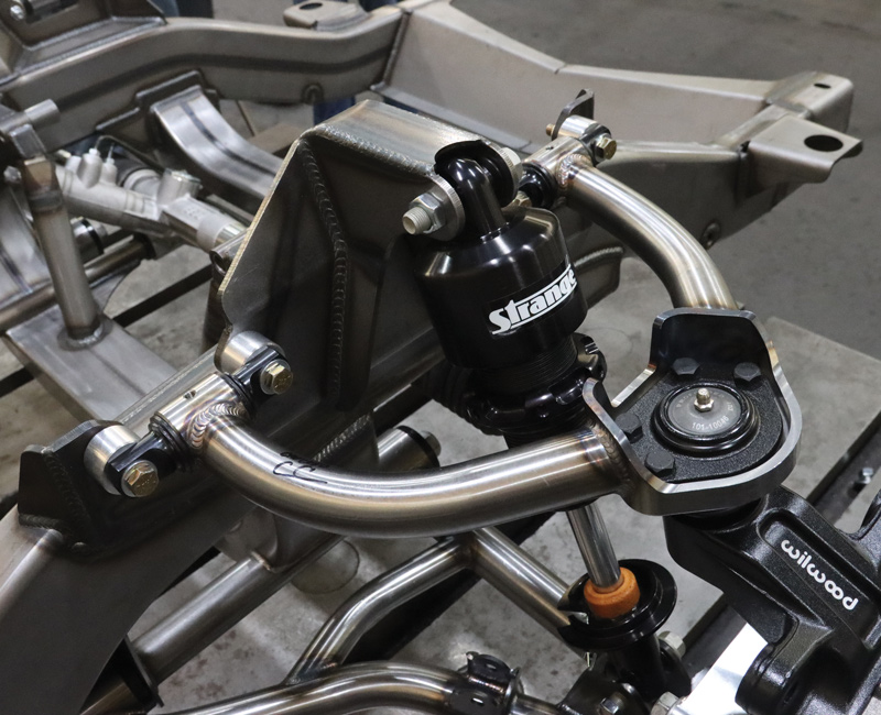 closer view of suspension and brakes on chasis