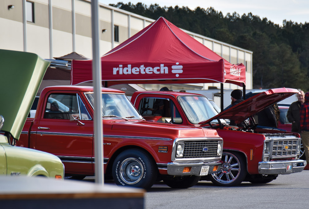 Red C10 and red Squarebody at Ridetech tent