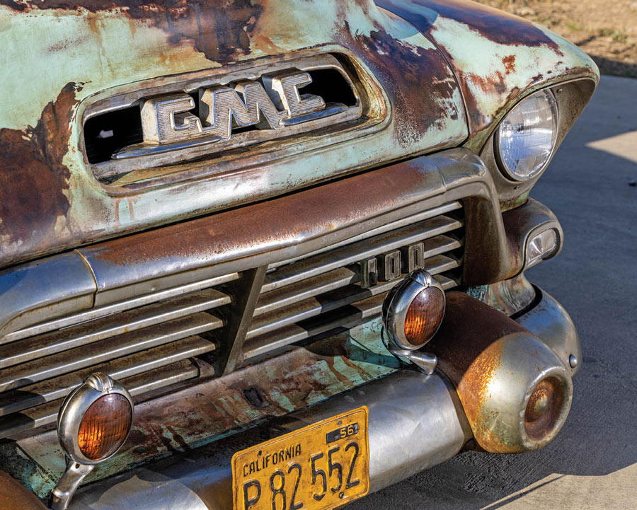 close up of the grille on a rusted blue '57 GMC