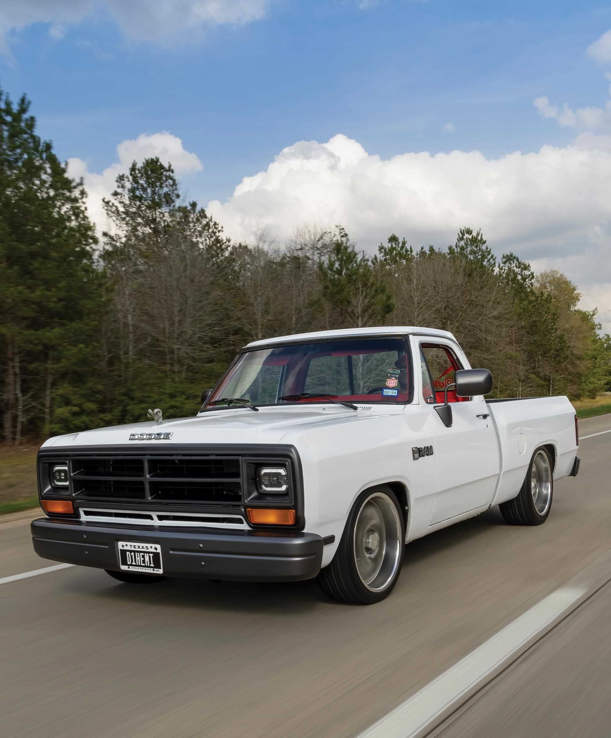 3/4ths driver's side view of the ’89 Dodge Ram D150 riding down a highway