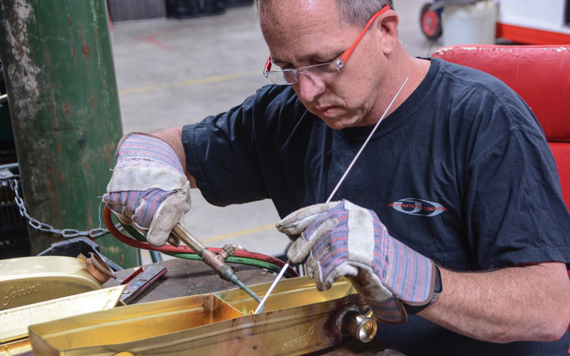 Johnson took great interest in learning the entire process of building a radiator and takes pride in each piece that leaves the facility. Here, Johnson is welding a divider in the tank, a piece that is only used for LS swaps.