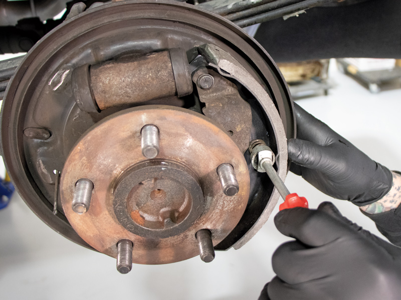 Since Duralast builds their parts to match the OE specs, the new brake shoe accepted the parking brake pivot connection and was installed right into position on the backing plate.